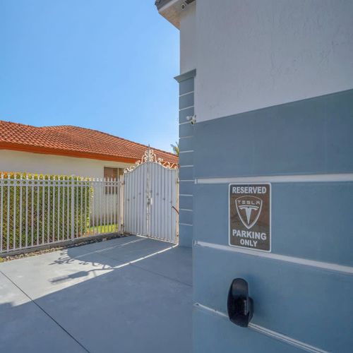 Private gated access leading into the driveway for added security and convenience.
