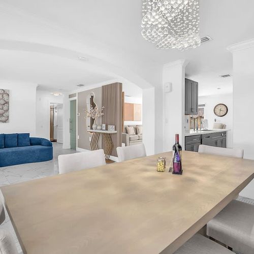 Stylish dining setup with a warm, inviting ambiance and seamless flow into the living areas.