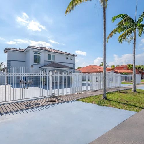 Bright, modern home with a fully fenced yard and secure gated driveway.