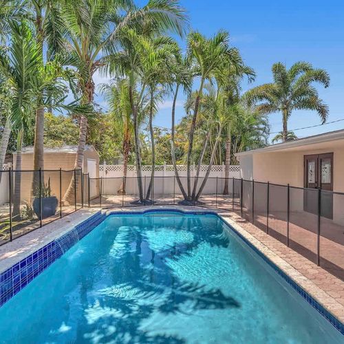Enjoy the best of South Florida outdoor living in this spacious backyard oasis featuring a private pool, tropical landscaping, and a fully fenced setting designed for relaxation and privacy.