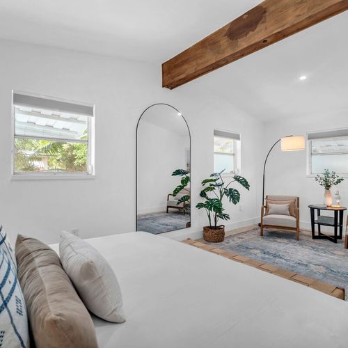 Perfect spot to get ready or unwind, featuring an arched full-length mirror and a cozy private lounge space.