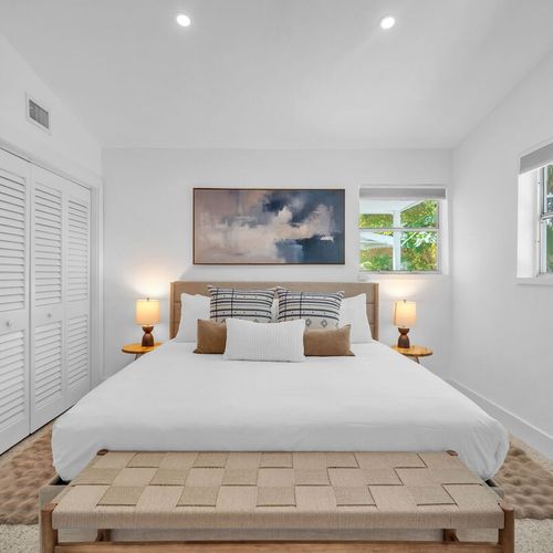 Spacious primary suite featuring a comfy King bed with plush bedding, and generous closet space.