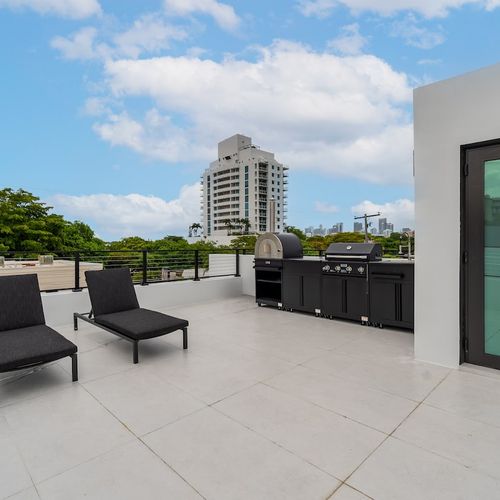 This impressive rooftop deck showcases the pinnacle of luxury outdoor living and modern entertaining.