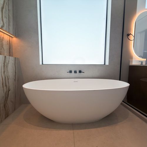 Indulge in a true spa experience in this stunning primary bathroom.