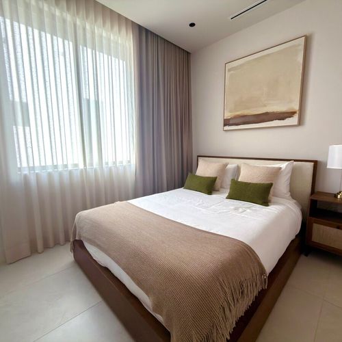 Welcome to your cozy home away from home. Our spacious second bedroom offers a peaceful ambiance with premium bedding, modern lighting, and curated artwork.