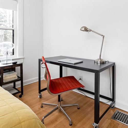 Your home away from home features a chic bedroom complete with a dedicated work desk and chair, ensuring a seamless blend of leisure and remote work. (Macbook not included) 300 mbps internet speed, Spectrum.