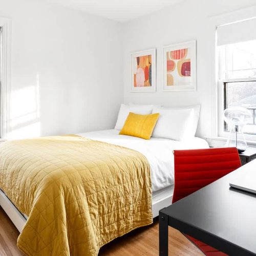 Your home away from home features a chic bedroom complete with a dedicated work desk and chair, ensuring a seamless blend of leisure and remote work. Discover the perfect escape for both business and leisure travelers. 
(Macbook not included)
