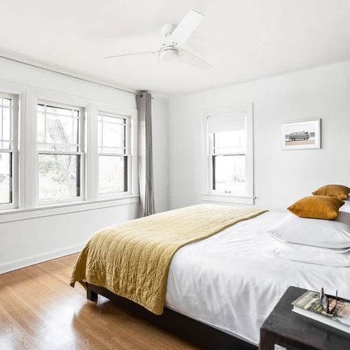 Luxurious King size bed with gel foam pillows,  down alternative comforter and lots of extra blankets. Plenty of storage in the double sliding door closet (not pictured) on opposite wall. Luggage racks in hall closet. —Blackout shades and drapes.