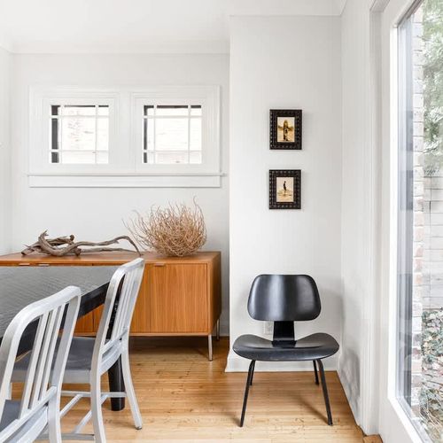 Natural elements: driftwood and a tumbleweed blend with mid-century classics.  Eames molded plywood lounge chair and the Emeco Navy chair (originally created in 1944 for the US Navy as a lightweight chair for ships and submarines).