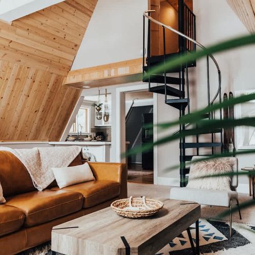 View of spiral staircase up to secondary bedroom