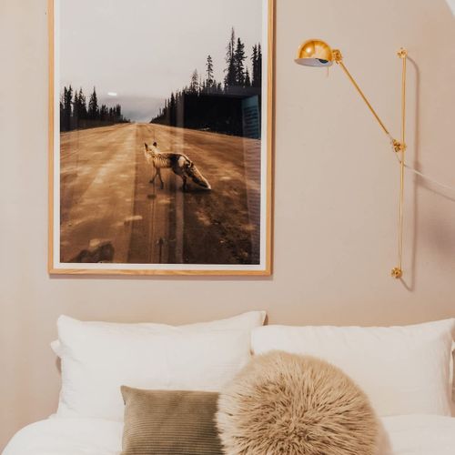 Snuggle up with a book and this reading light over the queen sized bed