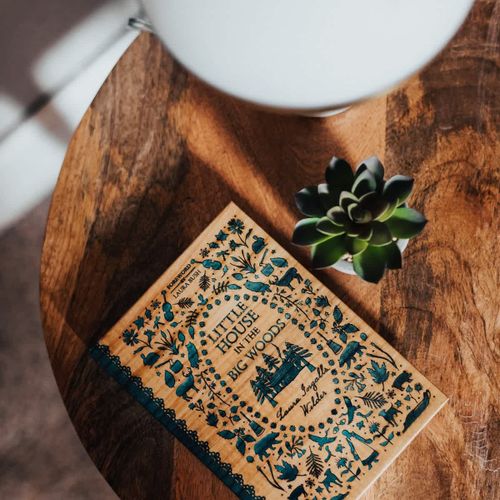 Page through Little House in the Big Woods by Laura Ingalls Wilder