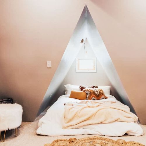 The first of two queen beds in the secondary bedroom