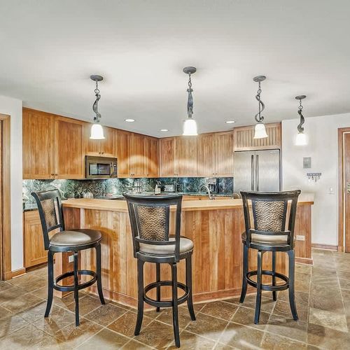 There are 3 stools at the bar