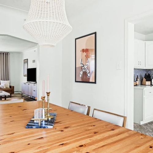 Dining area looks into both kitchen and living area
