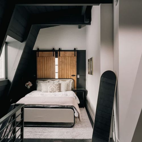 Primary loft bedroom with queen bed