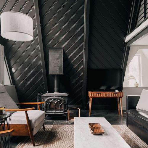 Open living area (the wood-burning stove is decorative only and does not operate)