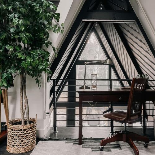 Loft area looks down to living area and kitchen below