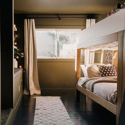 The second bedroom has 2 bunk beds, 4 twin beds total