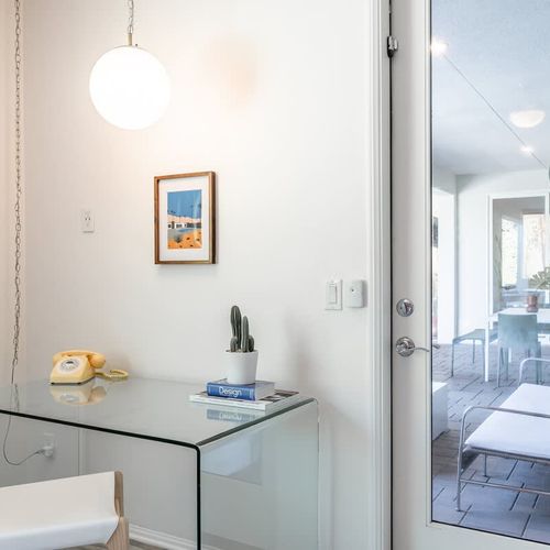 Workspace and patio exit in the primary bedroom