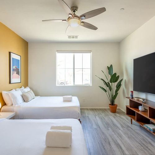 Bedroom 5 with 2 queen beds and TV