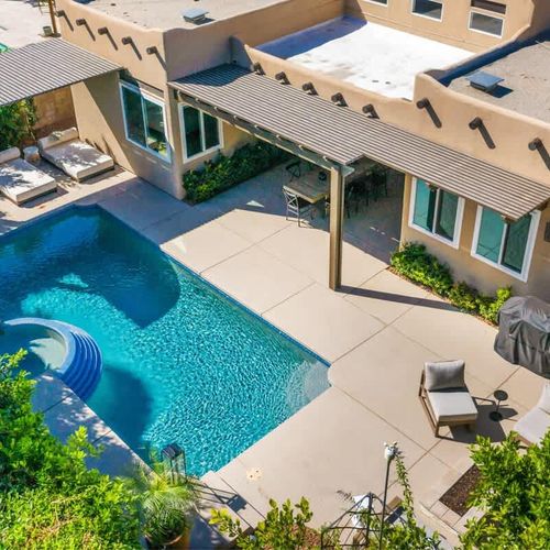 Backyard with pool and sun loungers