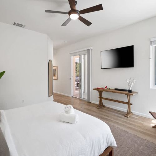 Primary bedroom with TV