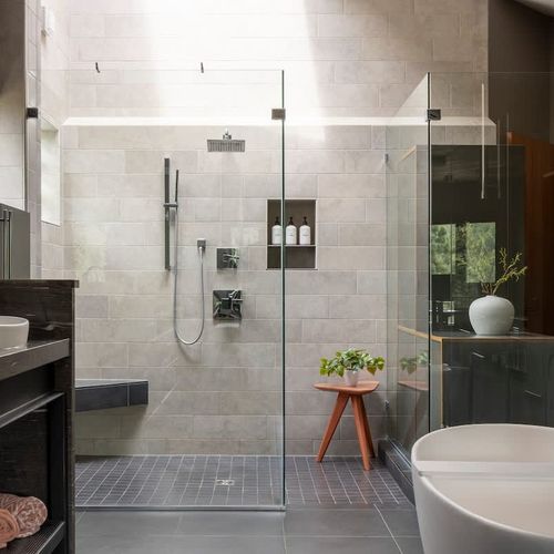 Primary en suite bathroom with stand-alone soaking tub and large shower