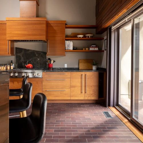 The kitchen has sliding doors leading to the covered back patio