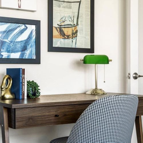 Office has a desk and chair