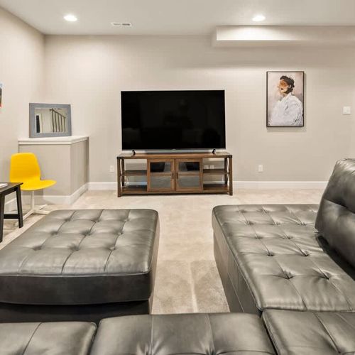 Lower level living area with large flatscreen TV