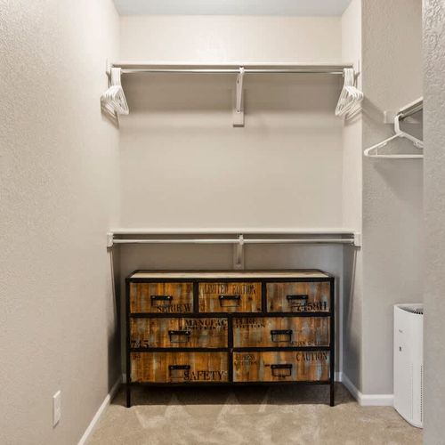 Primary bedroom's large walk-in closet