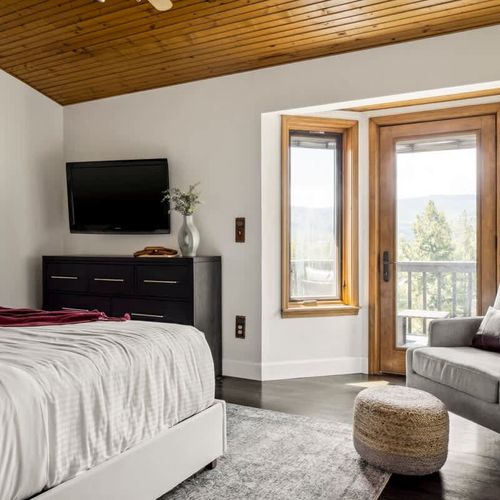 Primary bedroom with a view and private balcony access