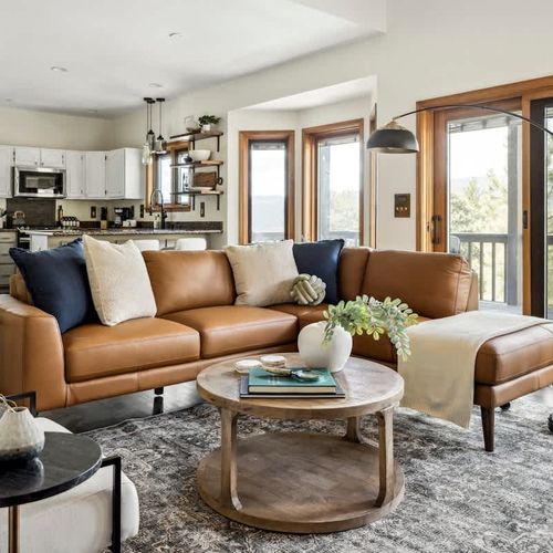 Main-level living area couch seating, seating area, and kitchen