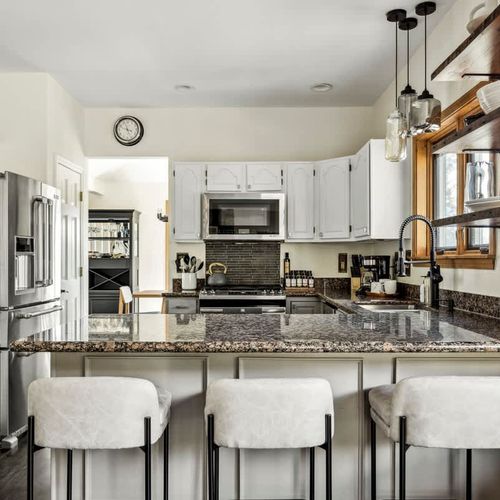 Open kitchen with bar-style seating