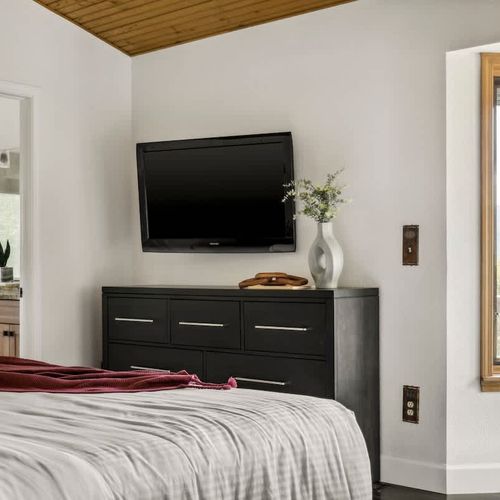 Primary bedroom with flatscreen TV