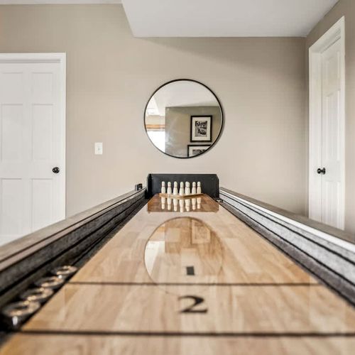 Game room with tabletop shuffleboard