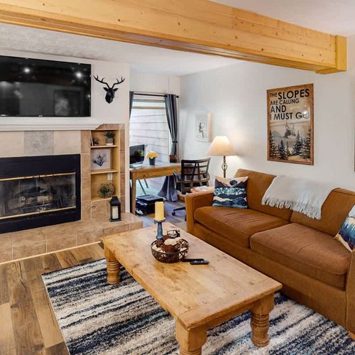 Living area with TV and gas fireplace