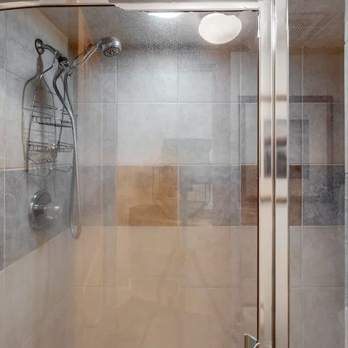 Full bathroom with walk-in glass shower