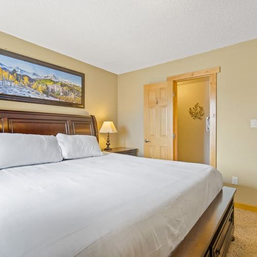 Primary bedroom with king bed and a private full ensuite primary bathroom