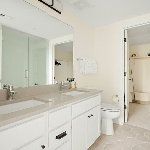 En suite bathroom has a double vanity