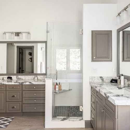 Bedroom 1 en suite bathroom with walk-in glass shower