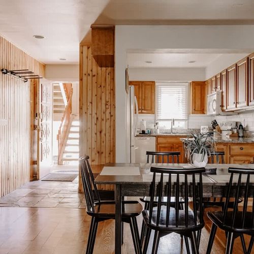 Entryway with dining area and kitchen