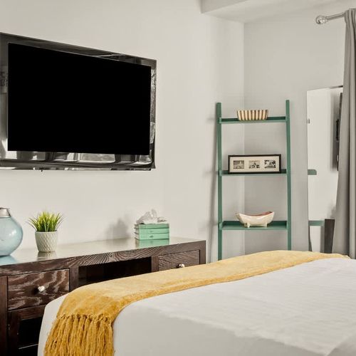 Entry level bedroom has a flat screen TV