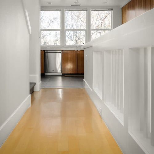 Walking from the main living area to the kitchen