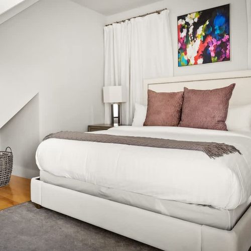 Primary bedroom with king bed has its own staircase from the main level