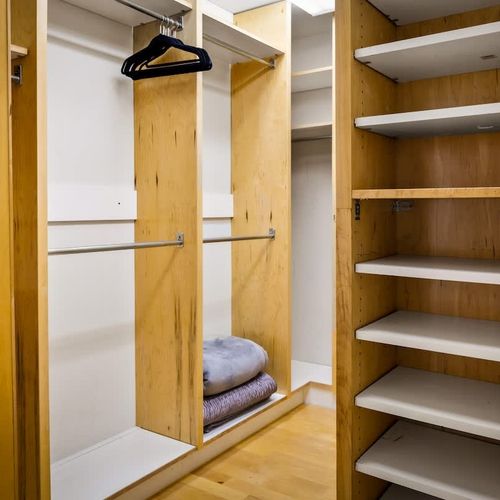Walk in closet in primary bedroom