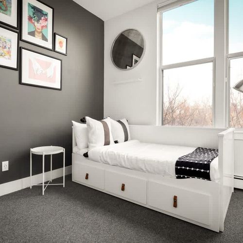 A separate staircase leads to another 3rd floor bedroom with a twin daybed + twin trundle