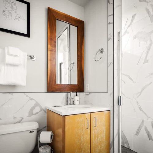 En suite bathroom with walk-in glass shower