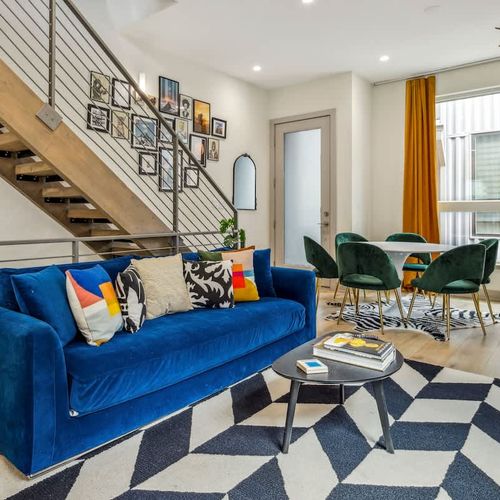 Living area queen sleeper sofa and dining area